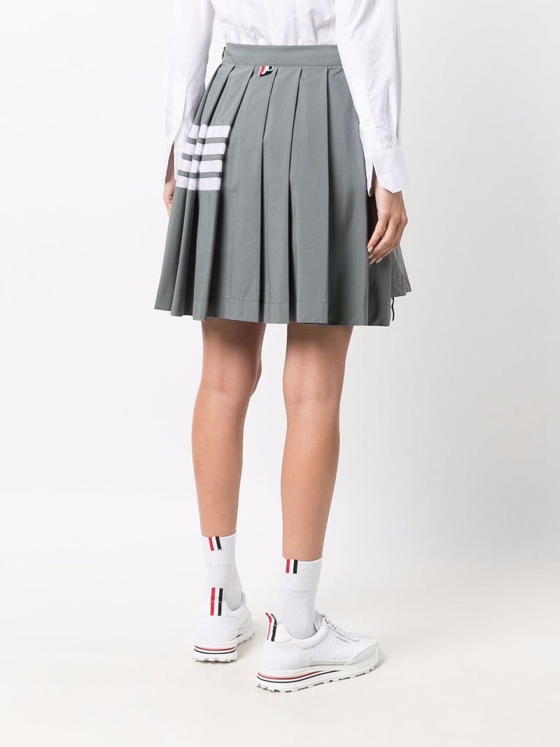THOM BROWNE WOMEN MINI DROPPED BACK PLEATED SKIRT W/ MESH 4 BAR IN SUSTAINABLE RIPSTOP - NOBLEMARS