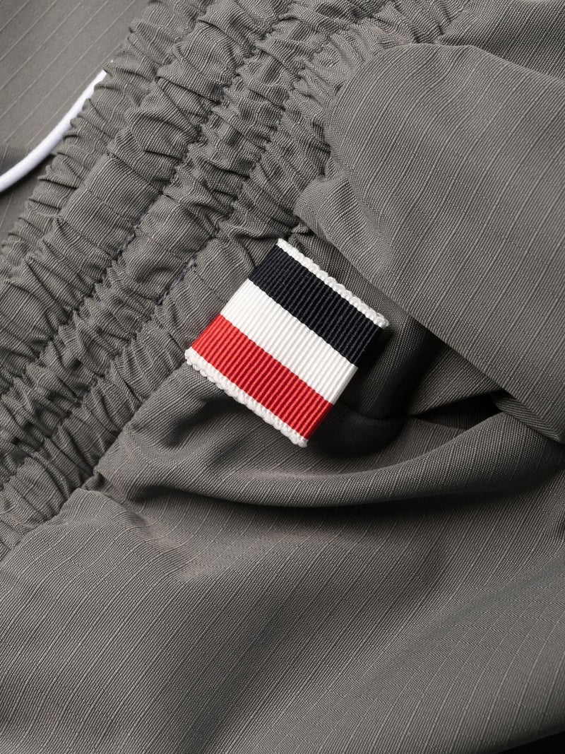 THOM BROWNE MEN PACKABLE TROUSERS W/ SEAMED IN MESH 4 BAR STRIPE IN MILITARY RIPSTOP - NOBLEMARS