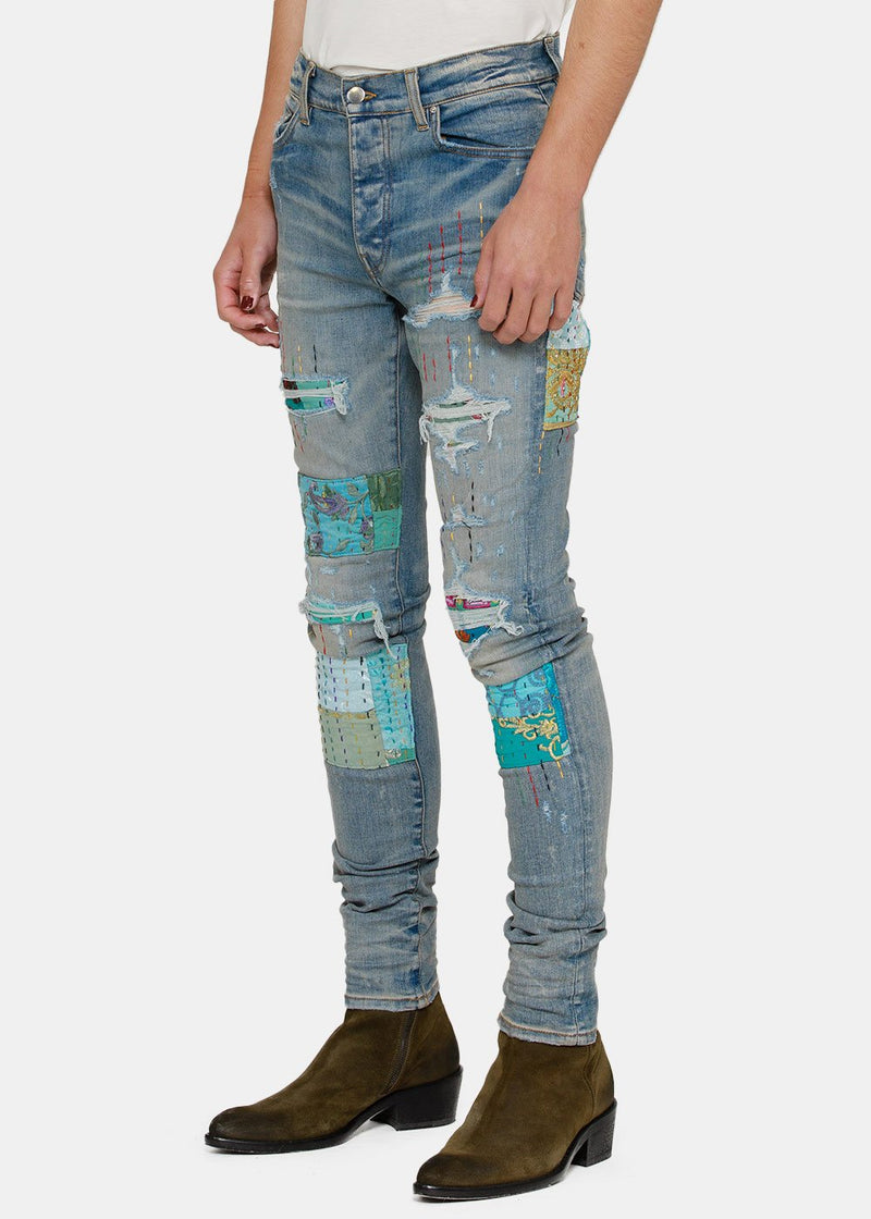 AMIRI Clay Indigo Quilted Artpatch Jeans - NOBLEMARS