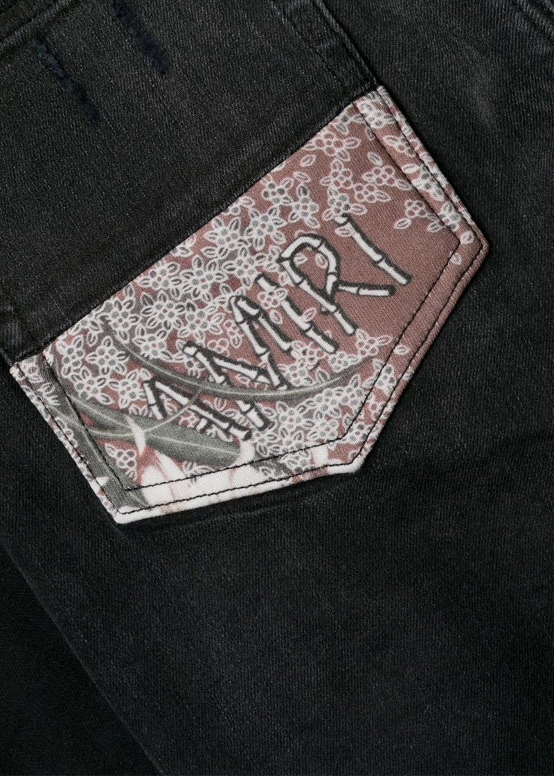 AMIRI Aged Black Hibiscus Artpatch Jeans - NOBLEMARS