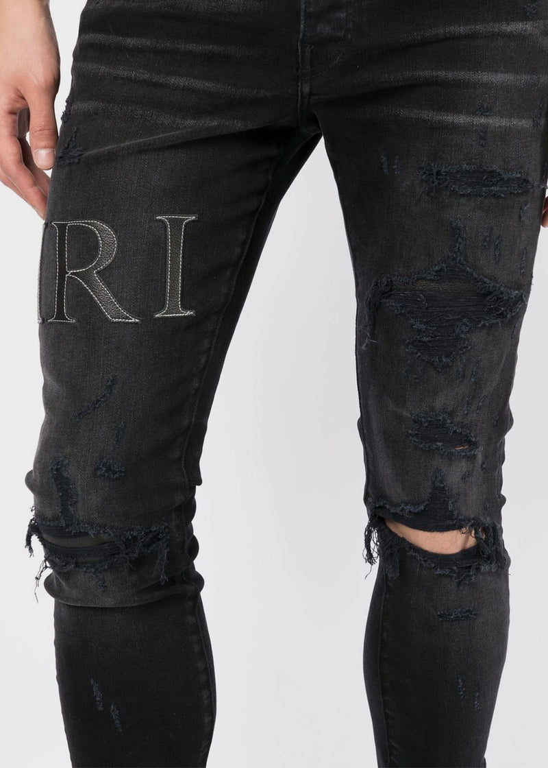 AMIRI Aged Black Leather Stitch Logo Jeans - NOBLEMARS
