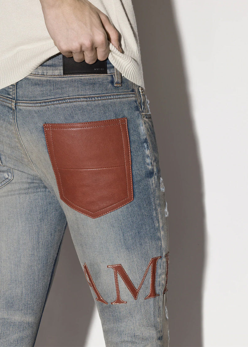 AMIRI Clay Indigo Leather Stitch Logo Jeans - NOBLEMARS